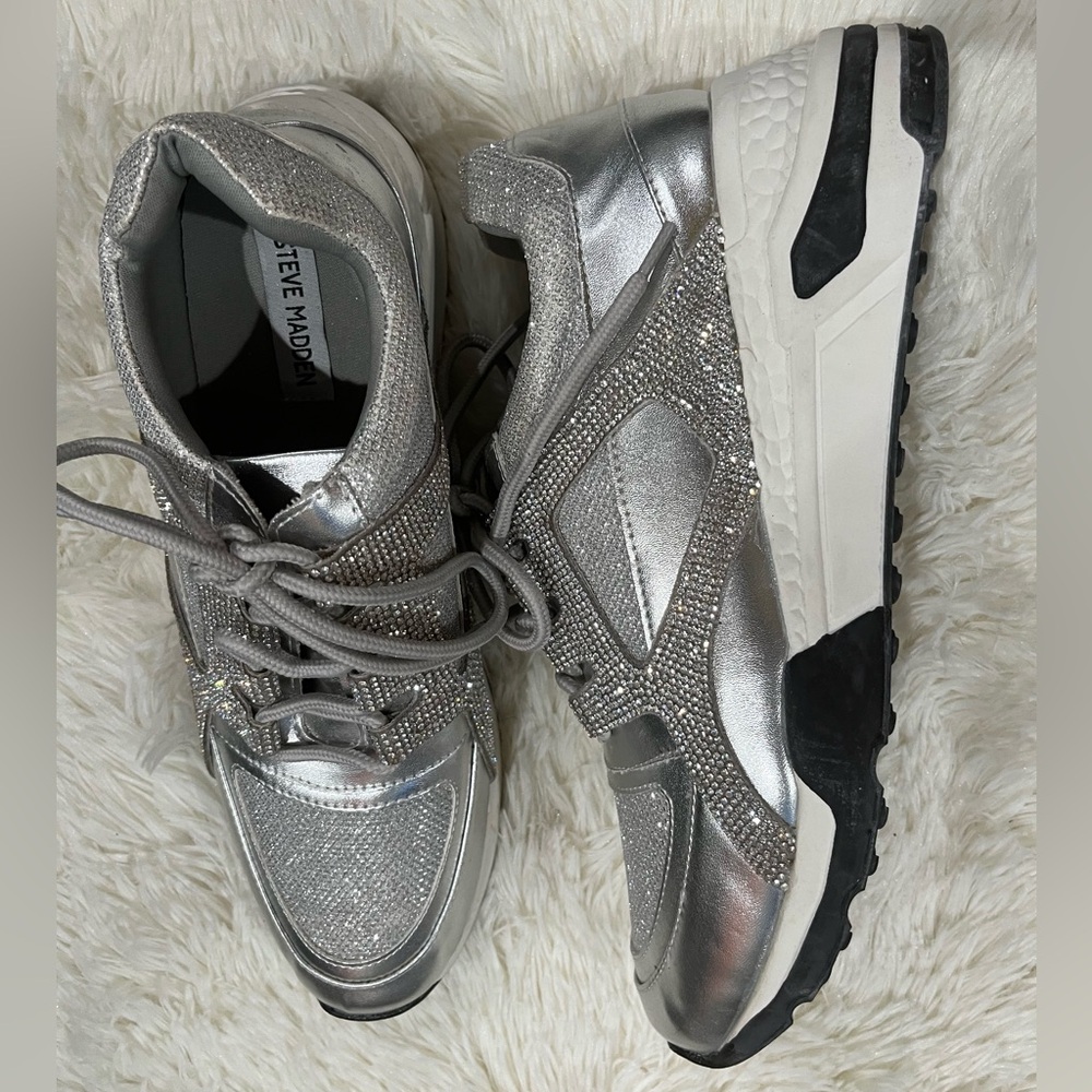 Steve Madden Silver Sneakers, with a small
Wedge heel.